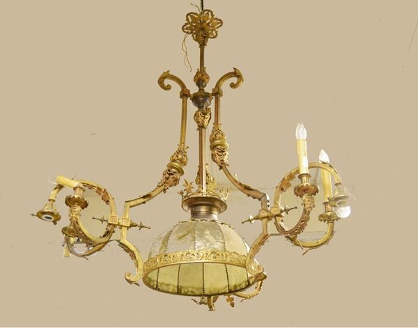 Lumiera Liberty, in bronzo dorato e lavorato, a dieci luci, alt. cm 145, diam. cm 110, difetti e mancanze