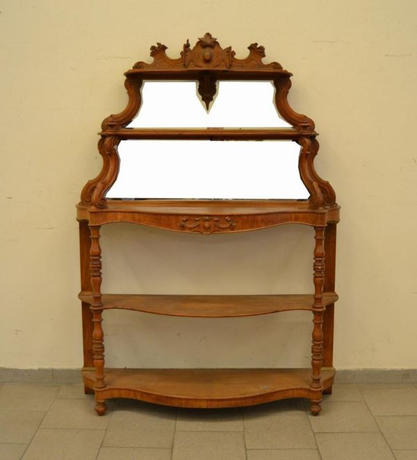  Etagere, sec. XIX, in mogano a cinque ripiani, parte superiore con specchio, cimasa intagliata, cm 125x35x174                                         