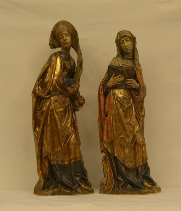  Coppia di sculture, Trentino, sec. XX, in legno policromo, raffiguranti FIGURE RELIGIOSE, cm 71x66, una con difetti 