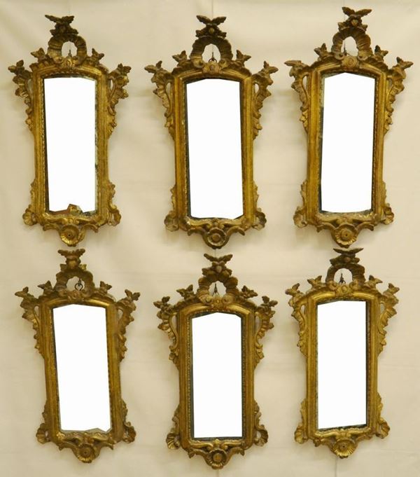 Sei specchiere, Veneto, quattro del sec. XVIII e due in stile 700, entro cornici dorate e intagliate, cm 69x36, difetti ( 6 ) 