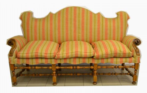 Divano, Lombardia, inizi sec. XVIII, fusto in noce, seduta a tre cuscini in stoffa, spalliera sagomata, cm 217x70x120