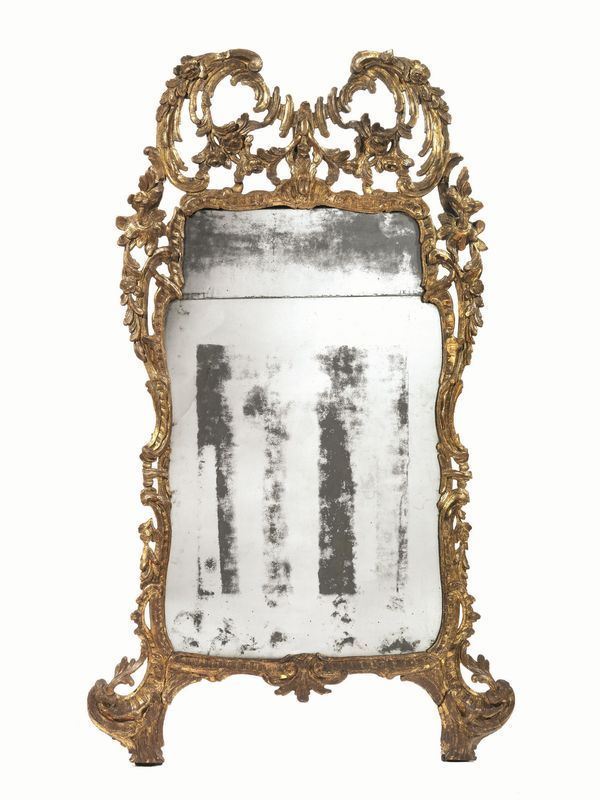  Specchiera, sec. XVIII,  in legno intagliato e dorato a mecca, cimasa a volute con tralci floreali ricadenti lungo i fianchi, cm 166x89,  mancanze e danni 