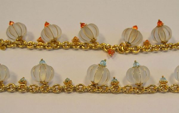Due bracciali in oro giallo titolo 375 e cristallo di rocca,               