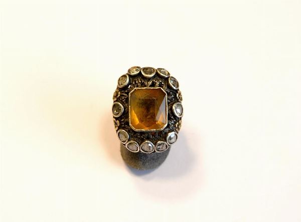  Anello, inizi sec. XX , in oro,argento,topazio e diamanti 
