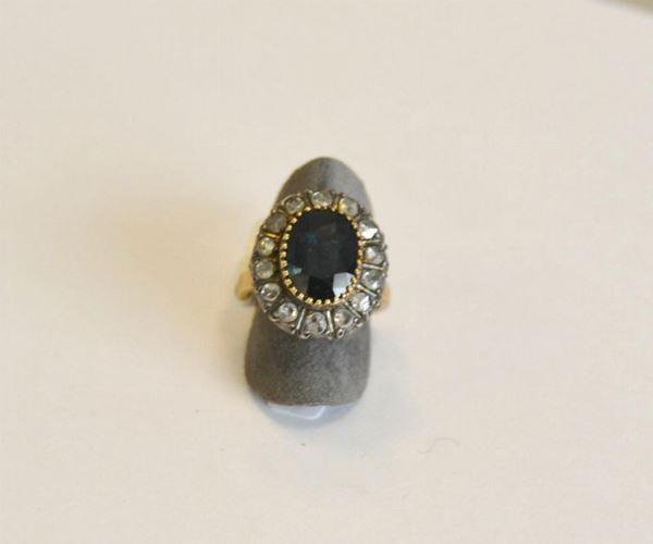  Anello in oro e argento, zaffiro e diamanti , 