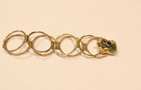  Bracciale trasformabile in anello, in oro basso titolo,    - Asta Gioielli, Argenti, Arredi, Dipinti e Oggetti d'arte - Poggio Bracciolini Casa d'Aste