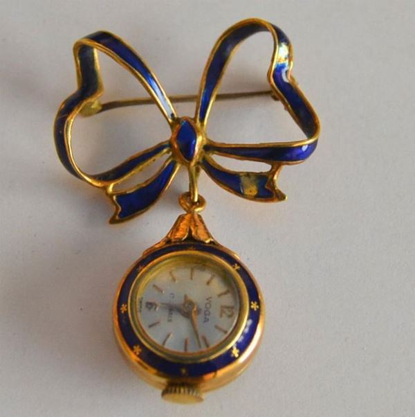  Spilla  a fiocco , con orologio pendente marca Voga 