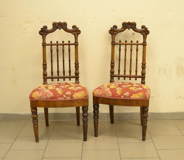  Due sedie, Francia, sec. XIX,  in noce, schienale a birilli,