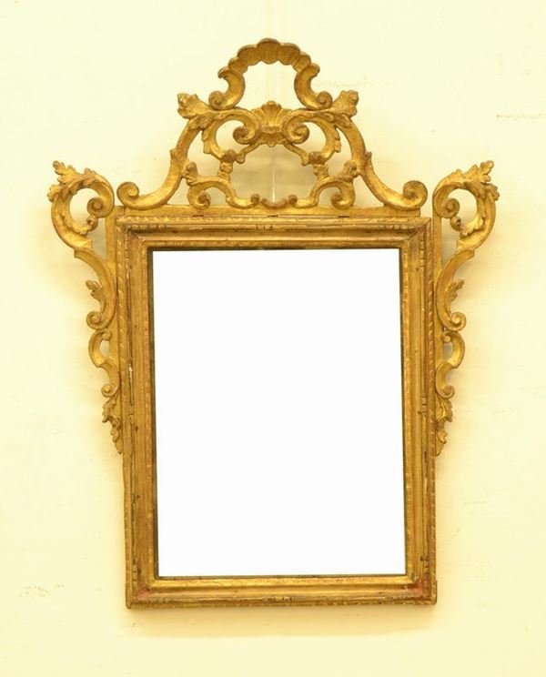  Specchiera, Toscana, sec. XVIII,  in legno dorato e 