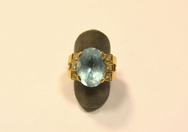  Anello in oro giallo, topazio e diamanti 
