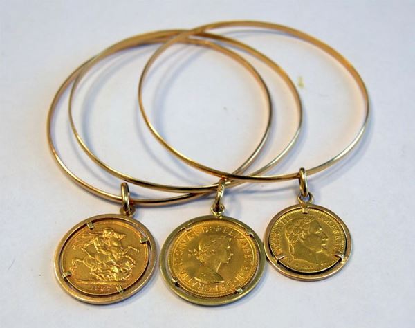 TRE BRACCIALI IN ORO GIALLO