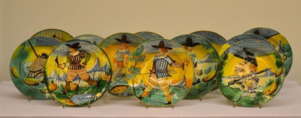 Dodici piatti, sec. XIX, manifattura Montelupo, in maiolica