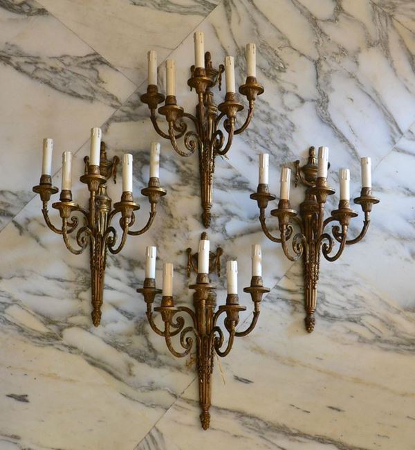 Quattro applique, sec. XX, in bronzo