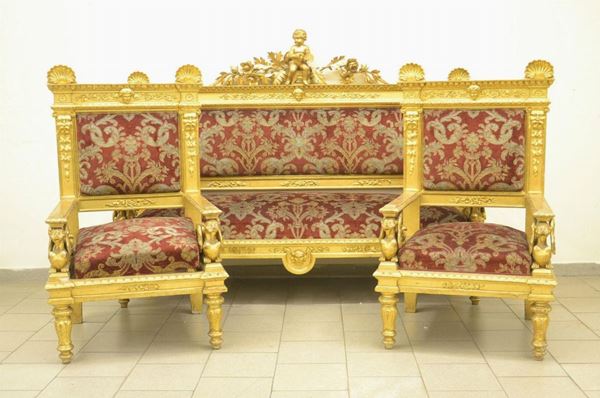 Divano e coppia di poltrone, in stile 700, inizi sec. XX, in legno dorato
