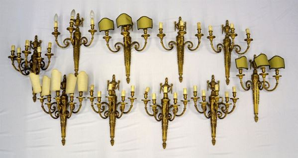 Dieci applique, sec. XX, in bronzo lavorato a tre e