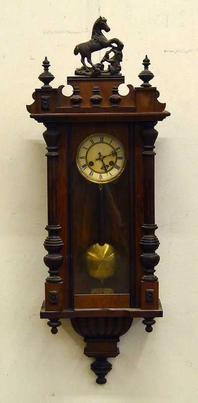 Orologio da parete, inizi sec. XX, cassa in legno con sovrastante