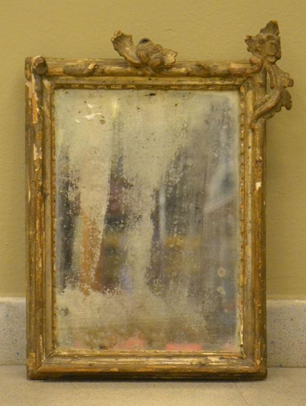 Cornice, sec. XVIII. in legno intagliato e laccato, cm 41x27&nbsp;&nbsp;&nbsp;&nbsp;&nbsp;&nbsp;&nbsp;&nbsp;&nbsp;&nbsp;&nbsp;&nbsp;&nbsp;&nbsp;