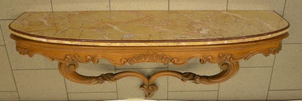 Consolle da parete, inizi sec. XX, in noce scolpito,                      