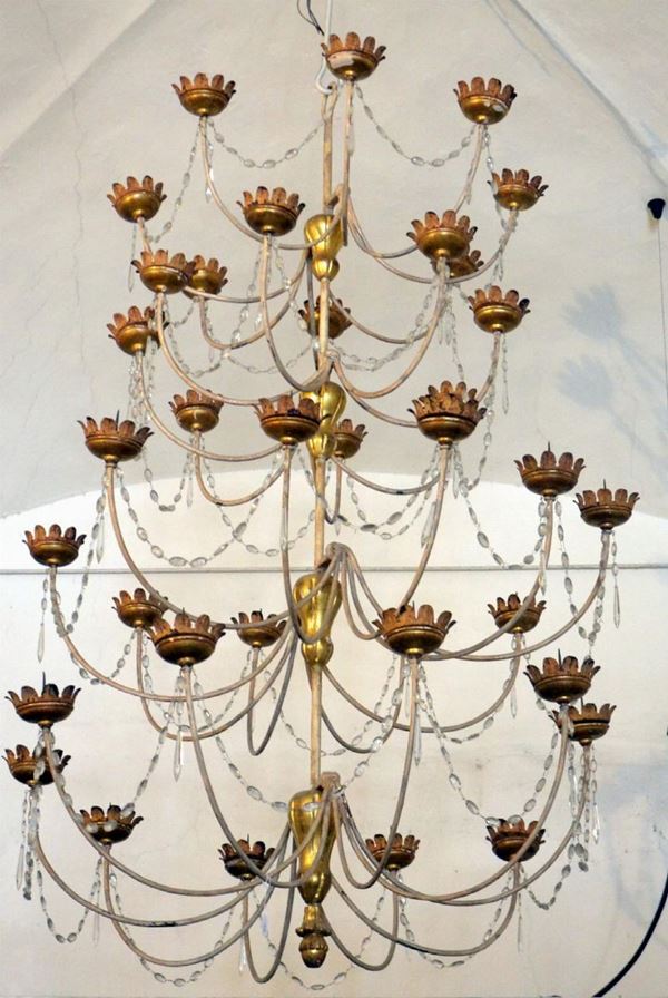 Grande lumiera, sec. XIX, in ferro e legno dorato,