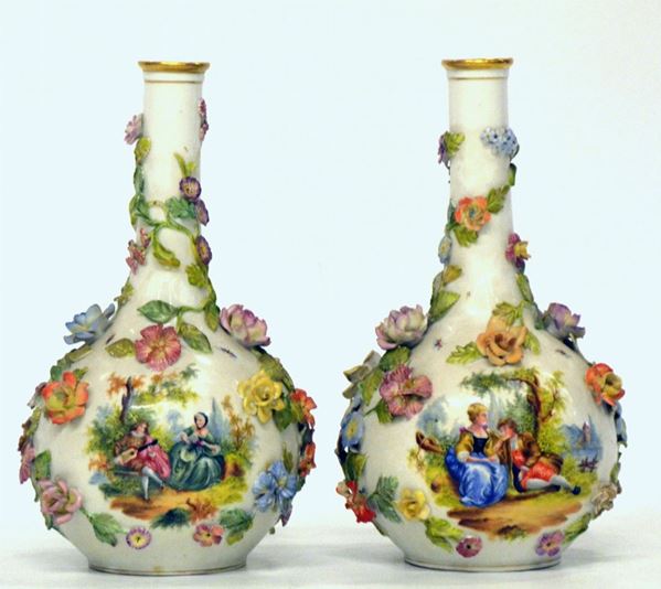 Due vasi, inizio sec. XX, in porcellana policroma decorata