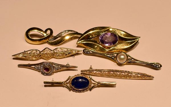 SETTE SPILLE IN ORO GIALLO E PIETRE PREZIOSE  - Asta GIOIELLI, ARREDI D'ANTIQUARIATO, DIPINTI E SCULTURE - Poggio Bracciolini Casa d'Aste
