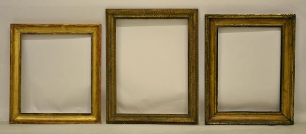 Tre cornici, inizi sec. XX, in legno dorato,