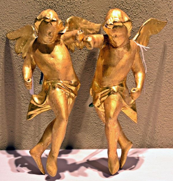 Coppia di sculture, sec. XIX, in legno intagliato e