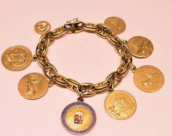 BRACCIALE , IN ORO GIALLO E SETTE MEDAGLIE