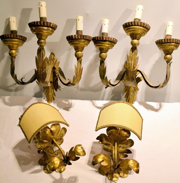 Due applique, inizi sec. XX, in metallo dorato e legno,