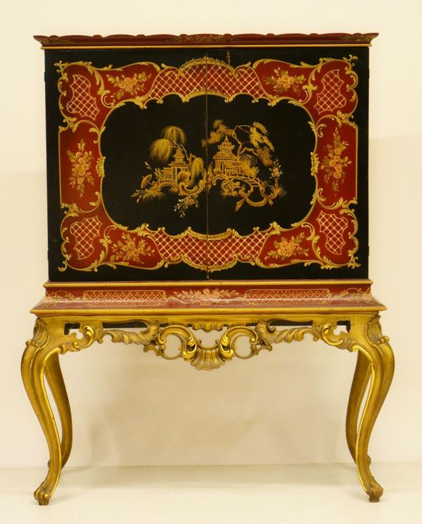 Mobile bar, sec. XX, in legno laccato e decorato