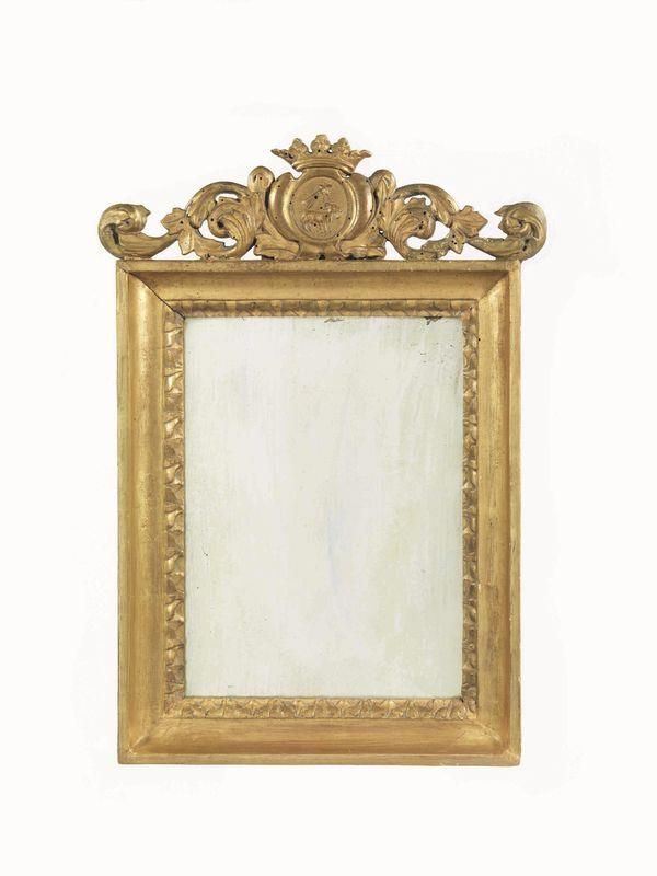 Specchiera, inizi sec. XIX, entro cornice in legno dorato e intagliato