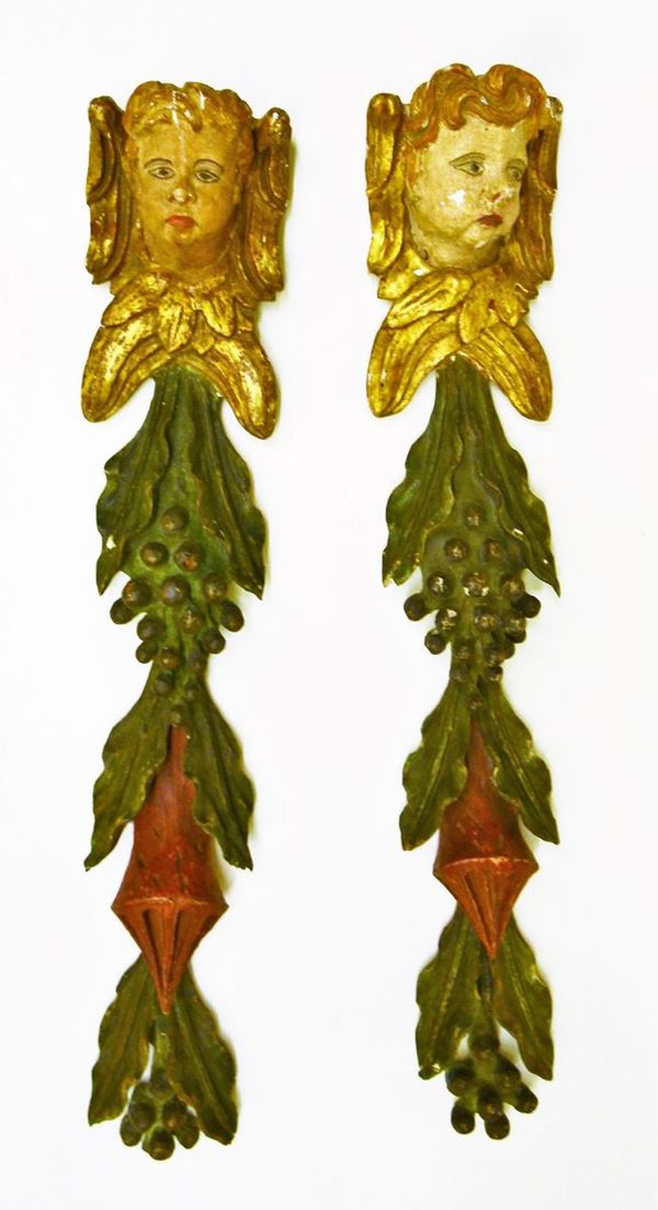 Due intagli, Marche, sec. XVII, in legno scolpito,