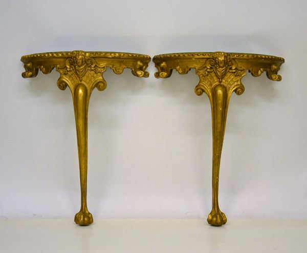 Coppia di consolle, sec. XIX, in legno dorato,
