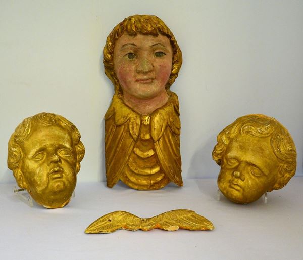 Quattro sculture, sec XVII, in legno intagliato,