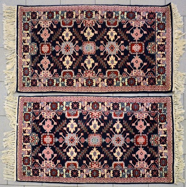 Coppia di tappeti scendiletto, Caucaso, sec. XX,