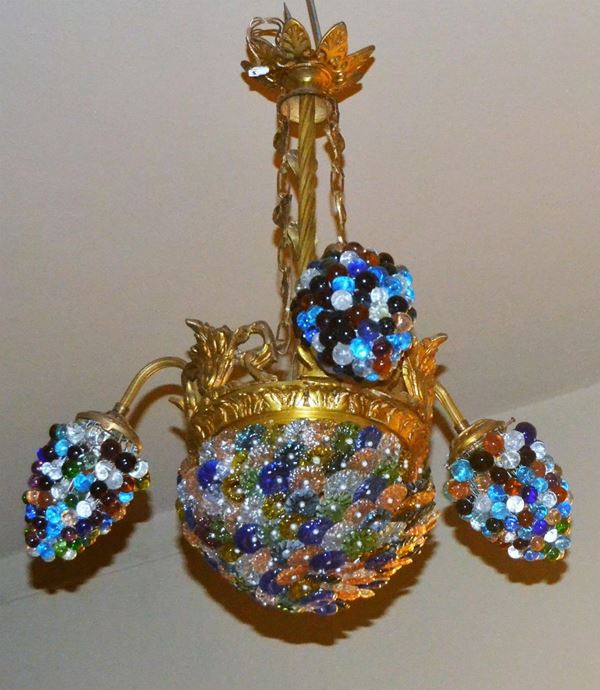 Lampadario, sec. XX, in bronzo dorato e decorato