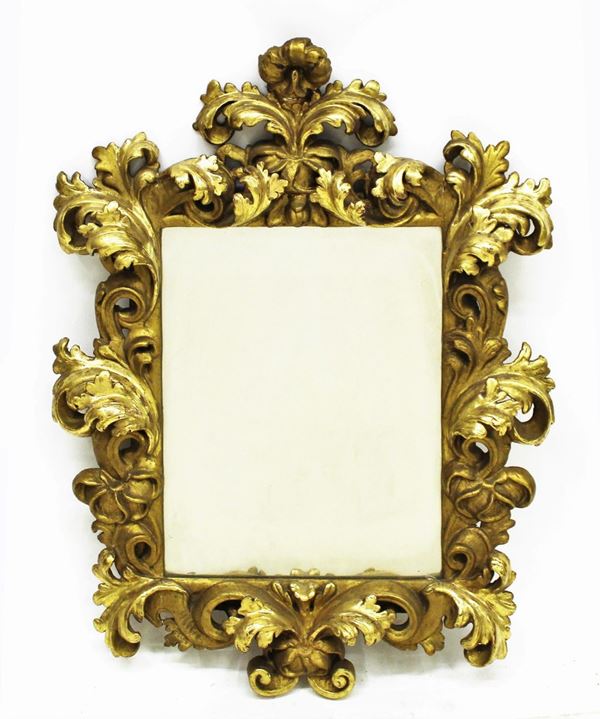 Specchiera, Emilia, sec. XVII, in legno dorato e intagliato a volute      