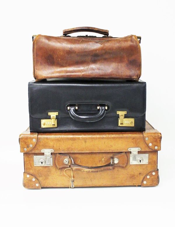 Tre valigie, sec. XX, in pelle, da viaggio, da medico e porta documenti, dimensione massima 55x41,5x22,5