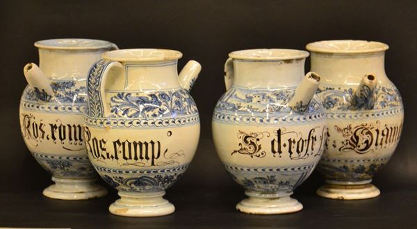 Quattro vasi da farmacia, sec. XIX, in maiolica decorata