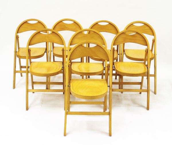 Otto sedie pieghevoli, sec. XX, in legno di faggio, modello Tric, designer Achille Castiglioni, produzione ZPM Radomsko e Italcomma Pesaro