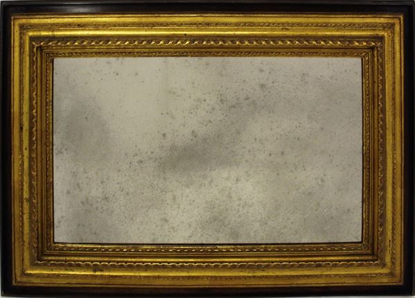 Specchiera, sec. XX, in legno tinto e dorato, luce rettangolare, cm 76,5x53,5