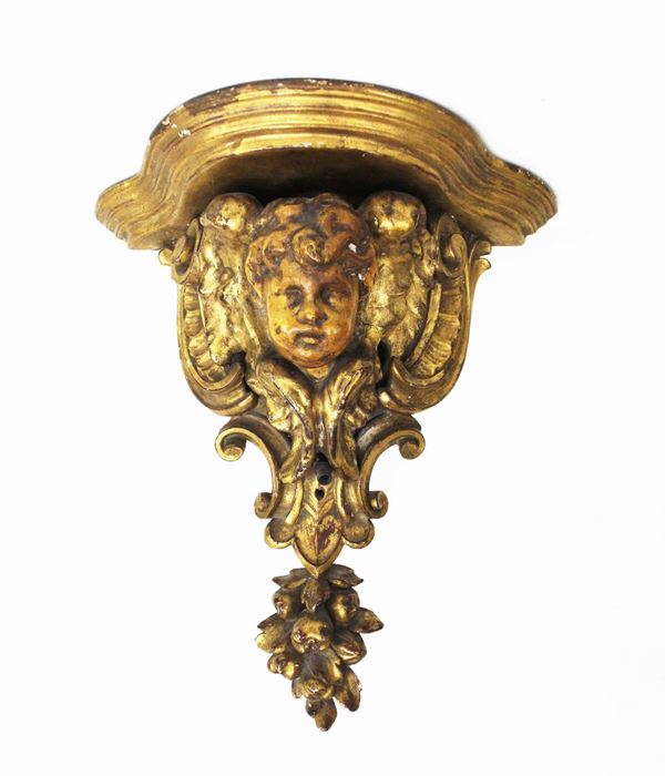 Mensola, sec. XIX, in legno dorato e&nbsp; intagliato a volute contrapposte&nbsp;&nbsp;&nbsp;&nbsp;