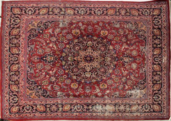 Tappeto persiano Mashad, sec. XX, impianto floreale nei toni del rosso, cm