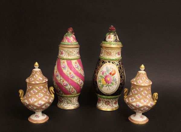 Due vasi con coperchio, Meissen, sec. XIX, in porcellana policroma, decorati a motivi floreali, prese a guisa di rose, alt. cm 24