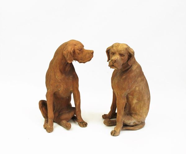 Coppia di sculture, inizi sec. XX, in terracotta modellata a guisa di     