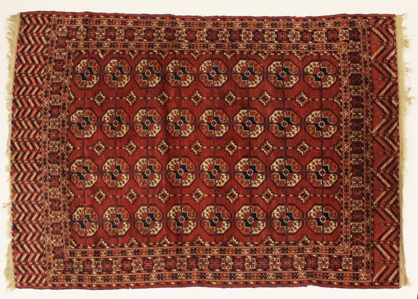 Tappeto, Bukara, sec. XX, impianto a gul su campo rosso, cm 195x151