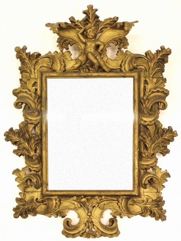 Specchiera, Emilia, sec. XVII, in legno intagliato e dorato, luce          