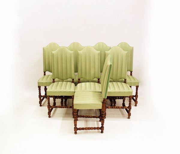 Otto sedie, in stile 600, in noce, rivestite in stoffa a rihe nei toni del