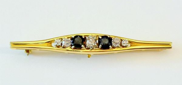 SPILLA IN ORO GIALLO. DIAMANTI E RUBINI