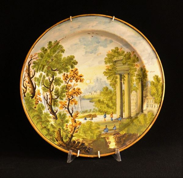 Piatto, Castelli, sec. XVII, in maiolica dipinta con